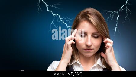 Lightning strikes and stressed woman with headache holding head Stock Photo