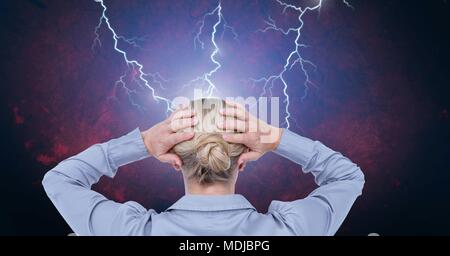 Lightning strikes and stressed woman with headache holding head Stock Photo