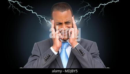 Lightning strikes and stressed man with headache holding head Stock Photo