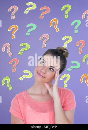 Woman thinking with colorful funky question marks Stock Photo