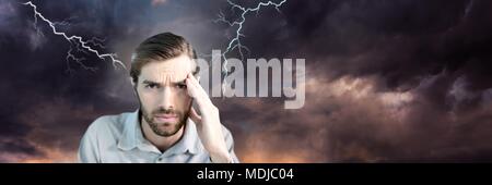 Lightning strikes and stressed man with headache holding head Stock Photo