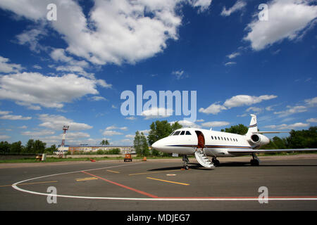 Falcon 2000 business jet is waiting for passengers and ready to go Stock Photo