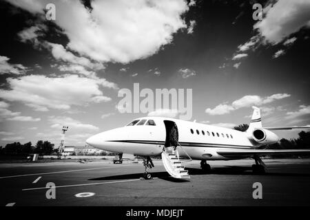 Falcon 2000 business jet is waiting for passengers and ready to go Stock Photo