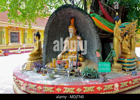 Wise man statue and Buddhas on the grounds of Wat Si Muang (Simuong) Laos, 2016. Stock Photo