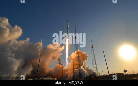 Cape Canaveral, USA. 18th Apr, 2018. A SpaceX Falcon 9 rocket carrying NASA's Transiting Exoplanet Survey Satellite (TESS) launches from Space Launch Complex 40 at Cape Canaveral Air Force Station in Florida on April 18, 2018. The TESS spacecraft will conduct a two year search for planets outside our solar system. (Paul Hennessy/Alamy) Credit: Paul Hennessy/Alamy Live News Stock Photo