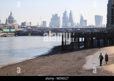 London UK. 20th April 2018. People walk along The River Thames at low tide on a sunny morning Credit: amer ghazzal/Alamy Live News Stock Photo