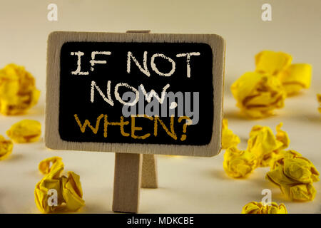 Text sign showing If Not Now When Question. Conceptual photo asking about time Putting plan To do list written Wooden Notice Board the plain backgroun Stock Photo