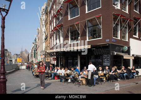 Amsterdam, Holland - 14 April 2018 People on the street in Amsterdam. Happy couple at shopping area Stock Photo