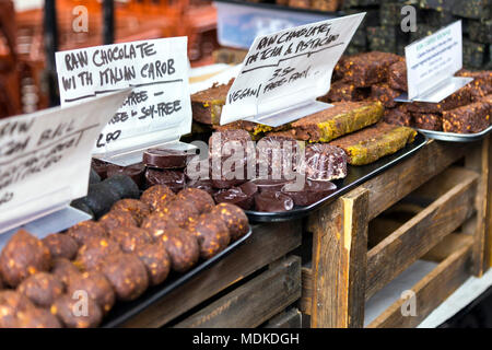 Raw Vegan treats and desserts at the Brick Lane food market, London, UK Stock Photo
