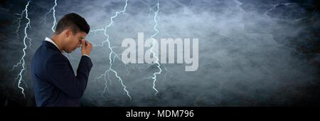 Lightning strikes and stressed man with headache holding head Stock Photo