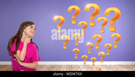 Woman thinking with gold question marks Stock Photo