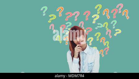 Woman thinking with colorful funky question marks Stock Photo