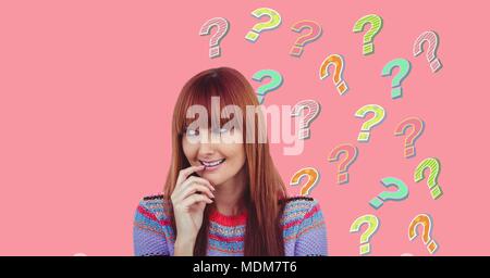 Woman thinking with colorful funky question marks Stock Photo