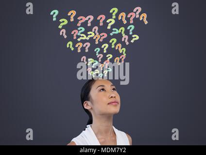 Woman with colorful funky question marks emerging from head Stock Photo