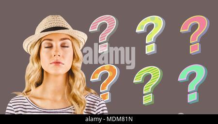 Woman with hat thinking with colorful funky question marks Stock Photo