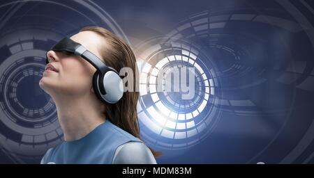 Woman with virtual reality headset and Glowing circle technology interface Stock Photo