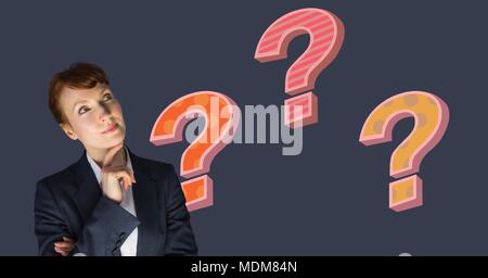Businesswoman thinking with colorful funky question marks Stock Photo