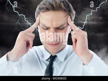 Lightning strikes and stressed man with headache holding head Stock Photo
