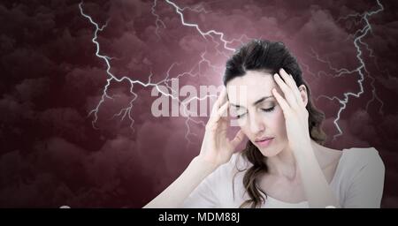 Lightning strikes and stressed woman with headache holding head Stock Photo