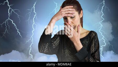 Lightning strikes and stressed woman with headache holding head Stock Photo
