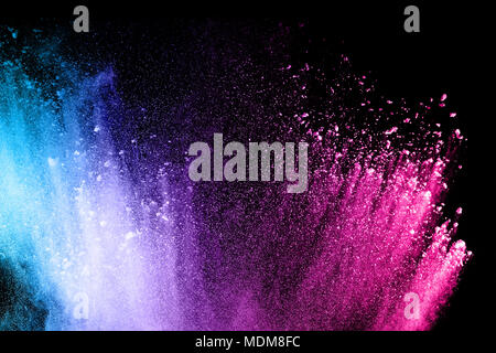 Multi color powder explosion isolated on black background. Stock Photo