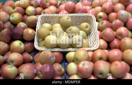 Asian pear in basket sold at market. Selective focus on pears of Asian variety. Stock Photo