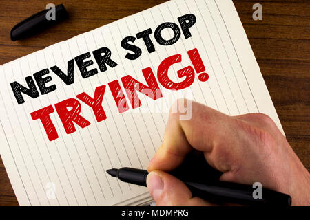 Conceptual hand writing showing Never Stop Trying Motivational Call. Business photo showcasing go on do not give up Self confidence written by Man Not Stock Photo