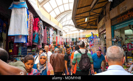 People at the old Bazaar and market of Acre, Israel, Packed with hundreds of shops and restaurants. Stock Photo