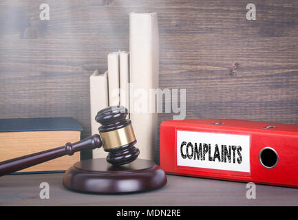 Complaints. Wooden gavel and books in background. Law and justice concept Stock Photo