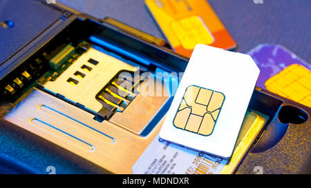 Ready to change old sim card on smartphone with blank new one Stock Photo