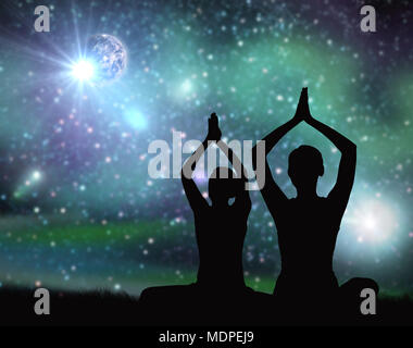 black silhouette of couple meditating over space Stock Photo