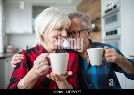 Portrait of happy senior couple having morning coffee together Stock Photo