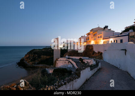 Night view of cliffside buildiings of the Albufeira town in Algarve, Portugal. Albufeira is a coastal city in the southern Algarve region of Portugal. Stock Photo