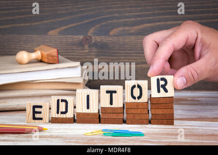 Editor concept. Wooden letters on the office desk, informative and communication background Stock Photo