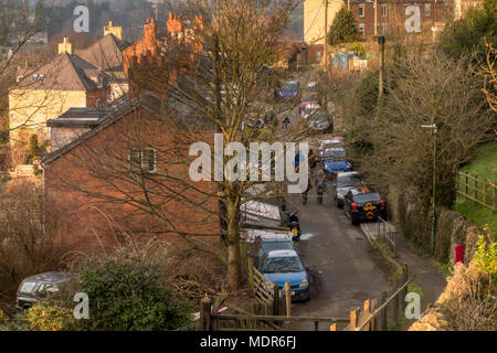 Cars parked along street in residential area of Stroud, Gloucestershire, UK Stock Photo