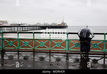 Umbrella on Brighton Promenade Overlooking Palace Pier on a Wet Day Stock Photo