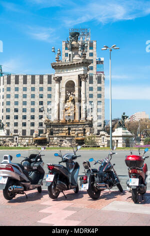 Motorbikes parked in front of the fountain at the PLaca d'Espanya in the Sants-Montjuic district of Barcelona. Stock Photo