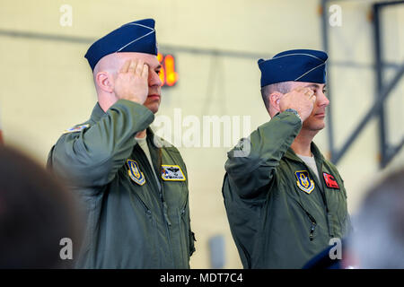 Lt. Col. Gerald Cook, left, outgoing commander of the 76th Fighter Squadron (FS) and Lt. Col. Brandon Kelly, incoming 76th FS commander, render salutes during an Assumption of Command ceremony, Dec. 3, 2017, at Moody Air Force Base, Ga. An Assumption of Command is a military tradition that represents a formal assumption of a unit’s authority and responsibility by a commander. (U.S. Air Force photo by Airman Eugene Oliver) Stock Photo