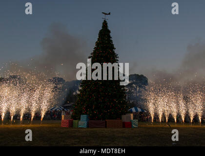 Air Commandos and family attended a Christmas tree lighting ceremony at Hurlburt Field, Fla., Dec. 1, 2017. Along with visiting Santa Claus and enjoying free food and games, family members continued a tradition of pinning yellow ribbons on a wreath to remember those deployed during this holiday season. (U.S. Air Force photo by Airman 1st Class Rachel Yates) Stock Photo