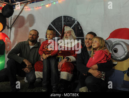 Air Commandos and family attended a Christmas tree lighting ceremony at Hurlburt Field, Fla., Dec. 1, 2017. Along with visiting Santa Claus and enjoying free food and games, family members continued a tradition of pinning yellow ribbons on a wreath to remember those deployed during this holiday season. (U.S. Air Force photo by Airman 1st Class Rachel Yates) Stock Photo