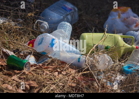 Abandoned bottles in the field Stock Photo