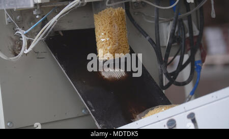 Food manufacturing - packing of macaroni in plastic bags Stock Photo