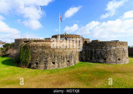 Deal Castle, one of the finest Tudor artillery castles in England. Dry moat, castle, Union Jack flag flying, bright sunshine and blue sky. Stock Photo