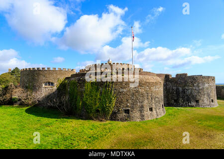 Deal Castle, one of the finest Tudor artillery castles in England. Dry moat, castle, Union Jack flag flying, bright sunshine and blue sky. Stock Photo