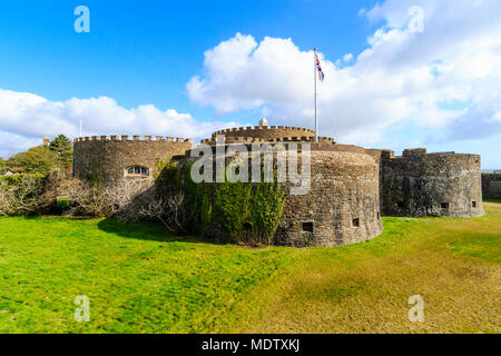 Deal Castle, one of the finest Tudor artillery castles in England. Dry moat, castle, Union Jack flag flying, bright sunshine and blue sky. Stock Photo