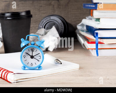 Still life round clock on stack of books. Education and learning concept. Invest time in studies. Time to upgrade ideas. Increase knowledge. Back to school. Copy space for text. Time read more. Stock Photo