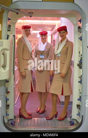 DUBAI, UAE - NOVEMBER 22, 2015: Emirates cabin crew attendants on board of Airbus A380. Stock Photo