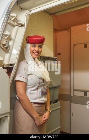 HONG KONG - NOVEMBER 16, 2015: Emirates cabin crew attendants on board of Boeing 777. Stock Photo