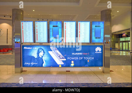 DUBAI, UAE - CIRCA NOVEMBER, 2015: flight schedule display at Dubai International Airport. It is the world's busiest airport by international passenge Stock Photo