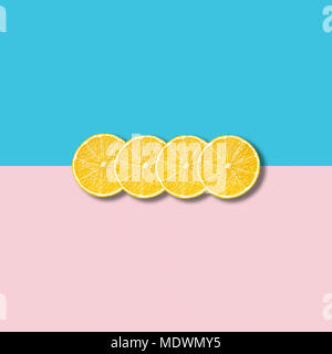 Minimal abstract illustration with group of lemon slices on pastel pink and turquoise background Stock Photo